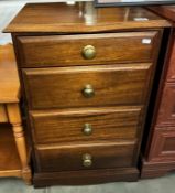 A dark wood stained 4 drawer chest with patinated brass handles COLLECT ONLY
