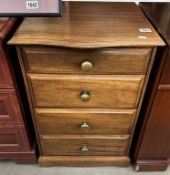 A dark wood stained 4 drawer chest with patinated brass handles COLLECT ONLY