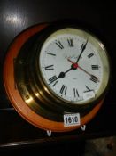 A mid 20th century battery operated ship's clock.