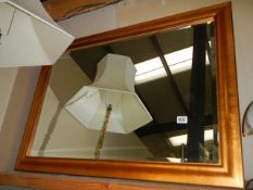 A large gilt framed bevel edged mirror in good condition, COLLECT ONLY.