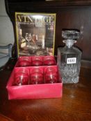 A mid 20th century cut glass decanter and a boxed set of six glasses.