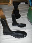 Three old metal shoe lasts.