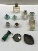 A quantity of glass items including bottles and a medieval mirror
