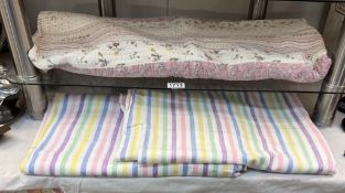 A pair of candy stripe bed sheets & a throw