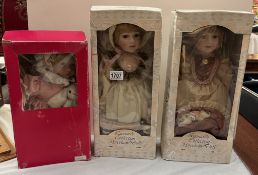 3 boxed porcelain headed collectors dolls
