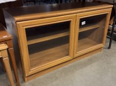 An oak effect glazed 2 door display cabinet