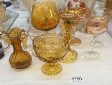 A quantity of vintage amber glass including brandy glass & candlestick etc.