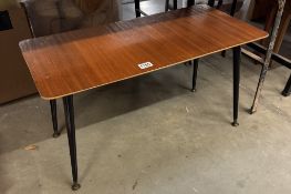 A retro teak veneered coffee table