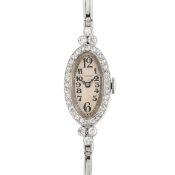 A LADY'S FINE PLATINUM & DIAMOND AUDEMARS PIGUET ART DECO COCKTAIL WATCH CIRCA 1920s WITH RETAILER'S