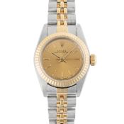 A LADY'S STEEL & GOLD ROLEX OYSTER PERPETUAL BRACELET WATCH DATED 1988, REF. 67193 ACCOMPANIED BY