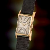 A RARE GENTLEMAN'S SIZE 18K SOLID GOLD CARTIER NEW YORK RECTANGULAR WRIST WATCH CIRCA 1947 Movement: