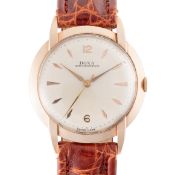 A GENTLEMAN'S LARGE SIZE 14K SOLID ROSE GOLD DOXA WRIST WATCH CIRCA 1950, WITH CLAW LUGS Movement: