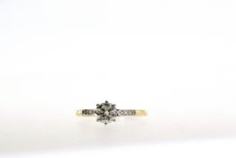 An 18ct Yellow Gold & Platinum Brilliant Cut Diamond Ring. (0.67 carats)