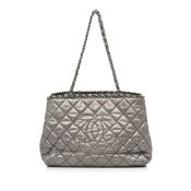 Chanel Chain Me Tote The Chain Me tote features a quilted leather body, leather woven chain strap,