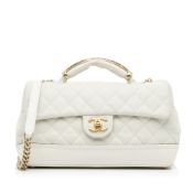 Chanel Medium Globe Trotter Flap Bag The Globe Trotter Flap bag features a caviar leather body, a