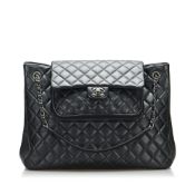 Chanel Paris-Edinburgh Lambskin Flap Tote This tote bag features a leather body, leather woven and