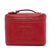 Chanel CC Caviar Vanity Bag This vanity bag features a caviar leather body, a flat top handle, a
