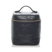 Chanel Timeless Caviar Vanity Bag This vanity bag features a caviar leather body, a flat top handle,