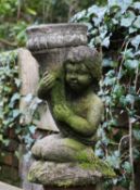 A kneeling putto vase