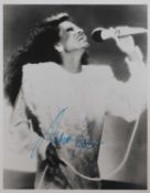 Six signed 10 x 8in signed photos of female musicians,