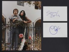 Eight popular music stars signed on white card and album pages,