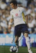 Twenty-one signed photos relating to football,