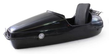 A Velorex Javelin Fibreglass Motorcycle Side Car, with black vinyl seat, chromed rear carrier and