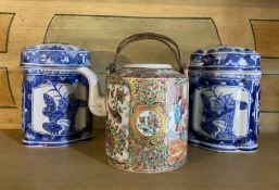 A late 19th century Cantonese tea pot and a pair of blue and white jars and covers