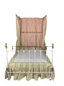 A Victorian cast iron and polished brass later white painted double bed