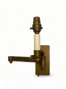 A single 'coin bronze' finished articulated library wall light by Besselink & Jones