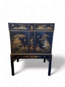 An early 20th century black japanned cabinet attributed to Hille