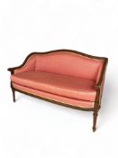 A Louis XVI style mahogany two seater bergere settee