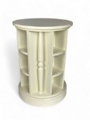 A contemporary white circular open bookcase by Chester Jones of Colefax and Fowler