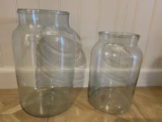 Two large glass open jars