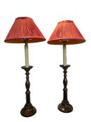 A pair of George III style mahogany turned candlestick table lamps