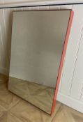 A contemporary orange glass framed rectangular mirror by Glas Italia