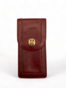 A vintage red Spanish leather cigar case retailed by Harrod's Ltd London