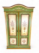A late 19th / early 20th century Swiss green, cream and polychrome floral painted armoire and a coat