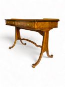 A Regency style burr ash sofa table by Baker Furniture