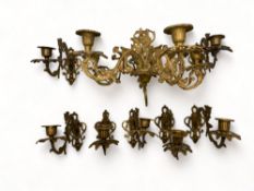 A set of gilt metal pierced and scrolling wall light sconces