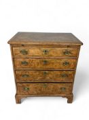 A small George I style walnut, crossbanded and featherbanded chest