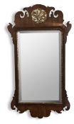 A George III mahogany fret carved and parcel gilt mirror
