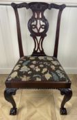 A close pair of George III Irish carved mahogany dining chairs