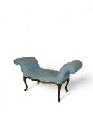 A George III mahogany serpentine window seat