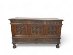 A late 17th century oak carved mule chest