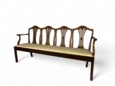 A George III mahogany quadruple chair back settee