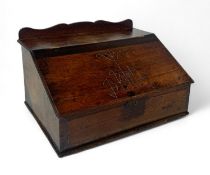 A 18th century oak carved clerk's desk