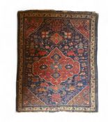 An antique Kurdish rug