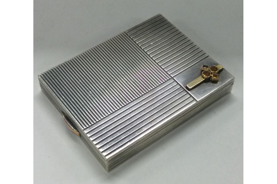 BOUCHERON: A gold and silver compact. - Image 1 of 2