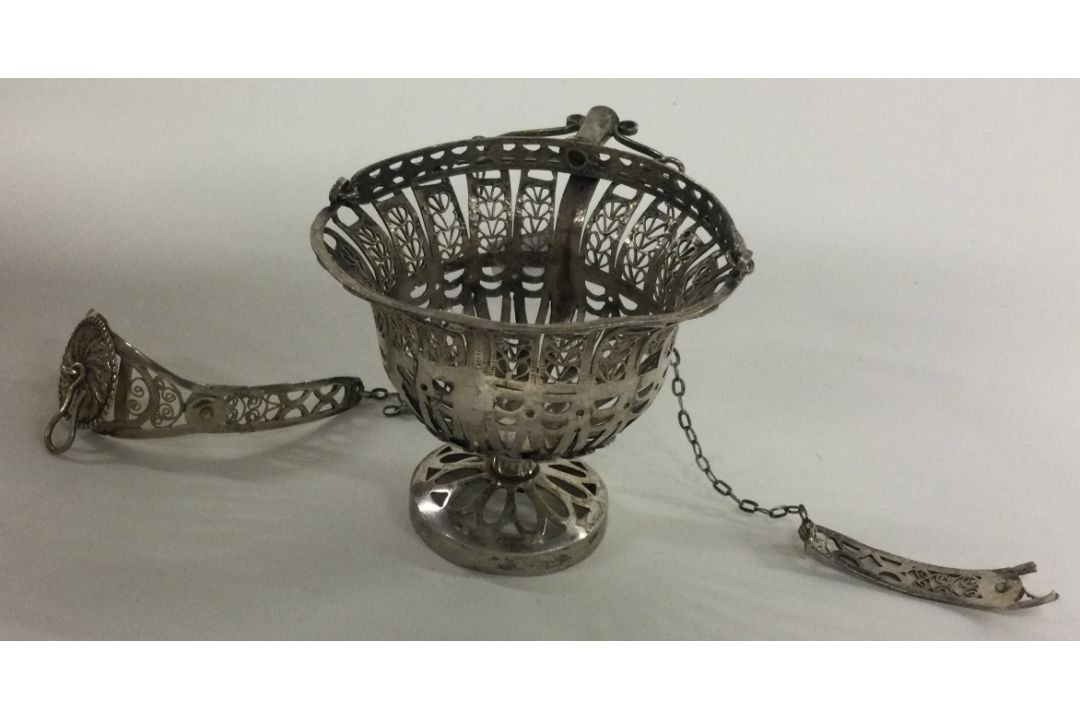 A Continental silver basket with suspension chains.